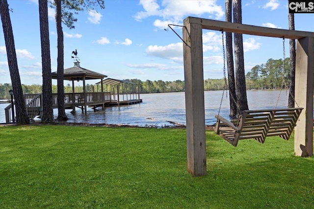 view of dock featuring a water view, a gazebo, and a yard