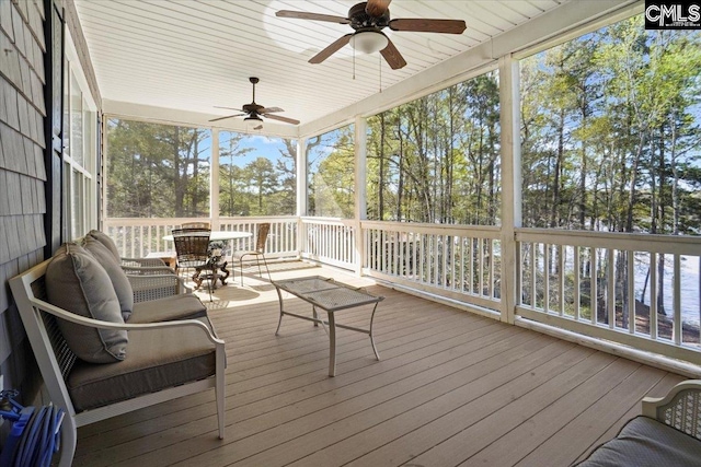 wooden terrace featuring ceiling fan