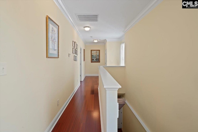 hall with ornamental molding and dark wood-type flooring