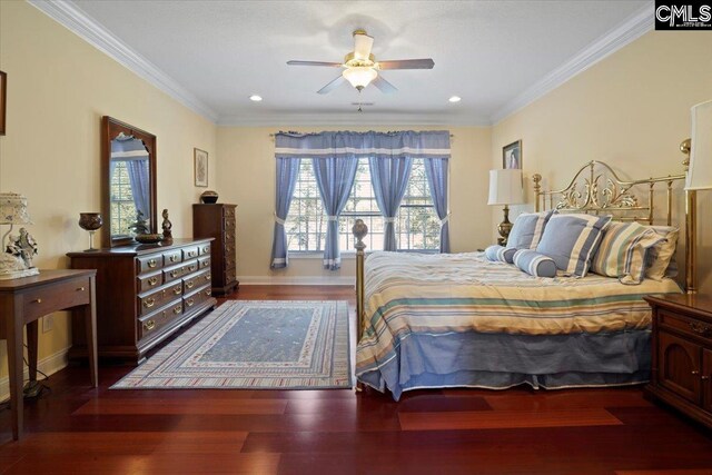 bedroom featuring dark hardwood / wood-style flooring, multiple windows, and ceiling fan