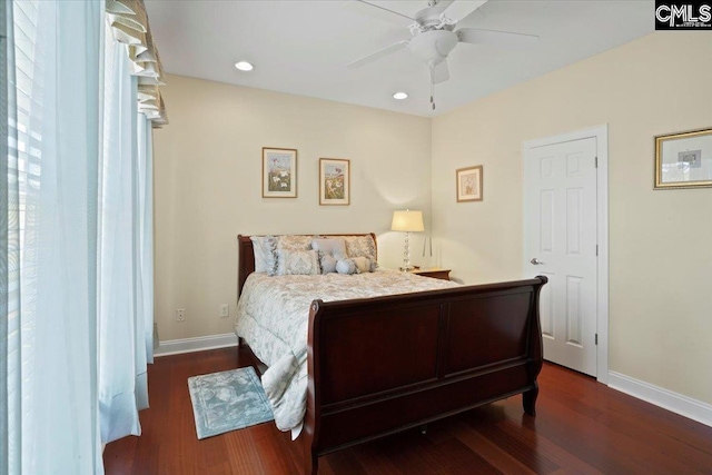 bedroom with dark wood-type flooring and ceiling fan