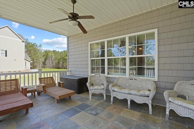 view of terrace featuring ceiling fan