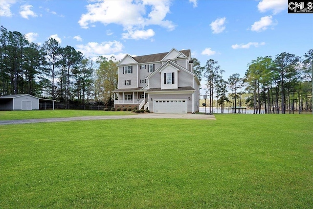 view of front facade with a garage, covered porch, and a front yard