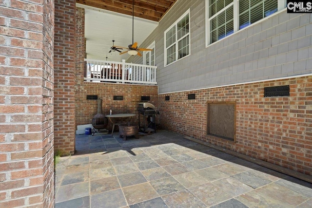 view of patio / terrace with ceiling fan and a grill