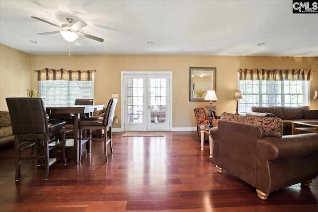 dining space featuring french doors, dark hardwood / wood-style flooring, and ceiling fan