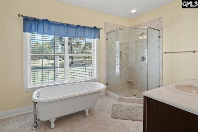 bathroom featuring independent shower and bath, a healthy amount of sunlight, and tile floors