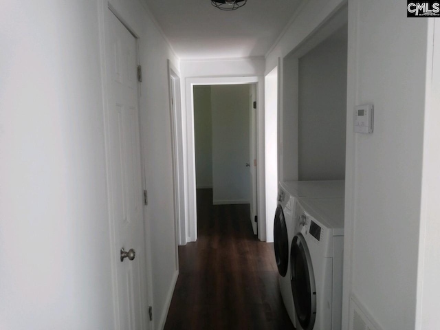 clothes washing area featuring separate washer and dryer and dark hardwood / wood-style floors