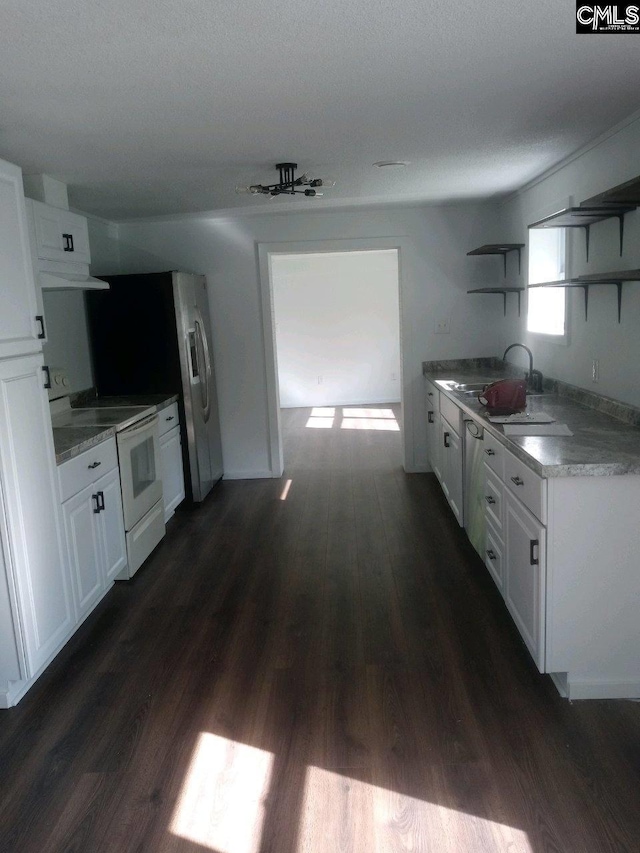 kitchen featuring white cabinets, electric range, and dark hardwood / wood-style floors