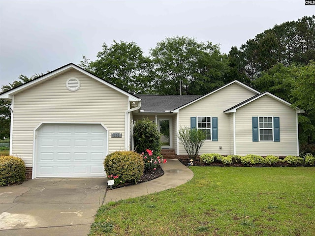 ranch-style house featuring a front yard and a garage