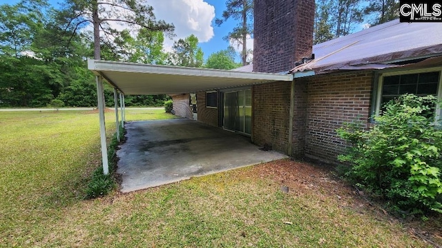 exterior space with a carport