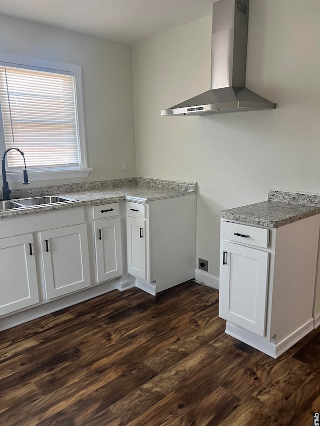 interior space featuring white cabinets and hardwood / wood-style flooring