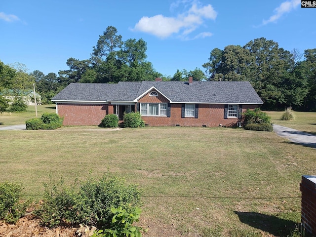 ranch-style home with a front yard