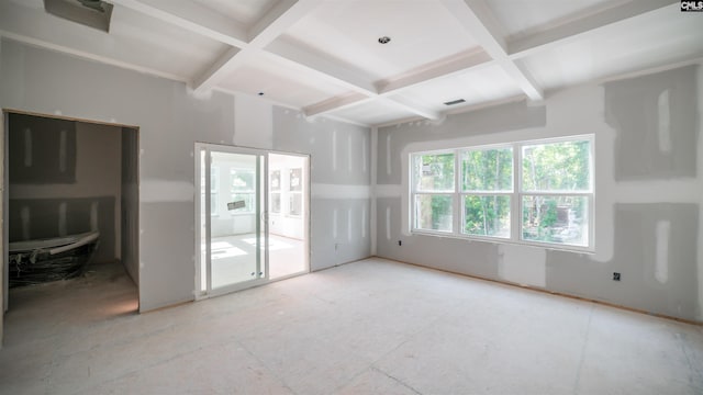 empty room with beamed ceiling and coffered ceiling