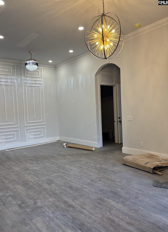 unfurnished room with crown molding