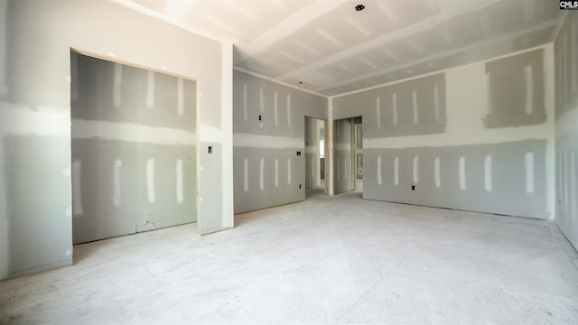 unfurnished bedroom featuring concrete floors