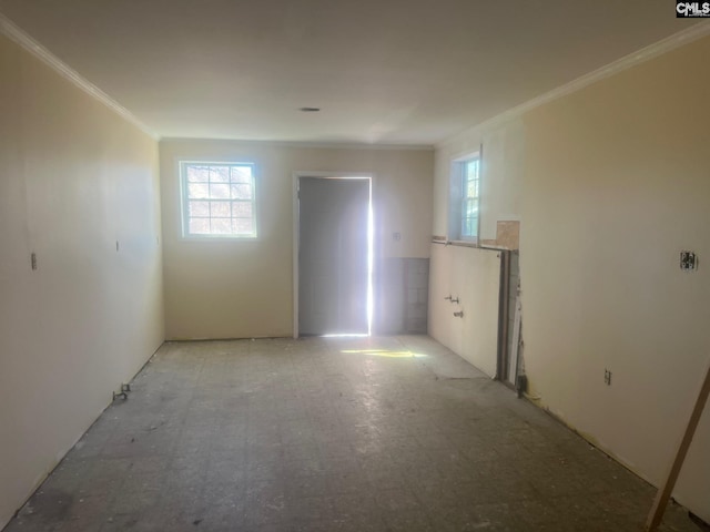 unfurnished room featuring ornamental molding