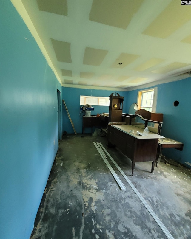 bedroom featuring unfinished concrete flooring