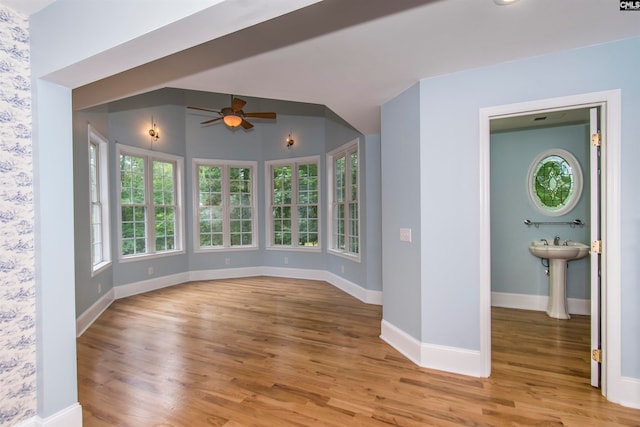 interior space featuring ceiling fan and light hardwood / wood-style flooring