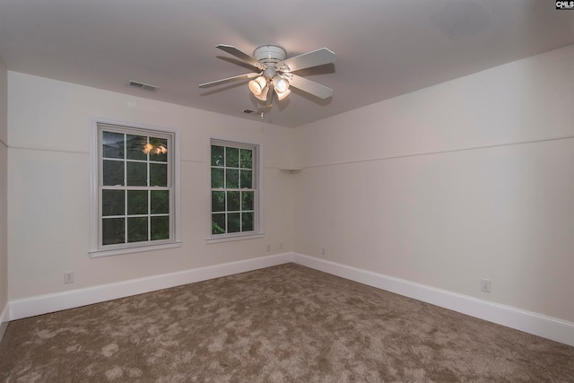 unfurnished room featuring ceiling fan and carpet floors