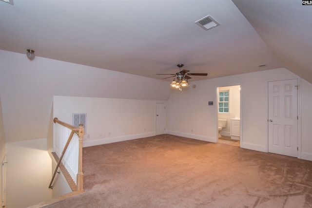 bonus room featuring carpet flooring, vaulted ceiling, and ceiling fan