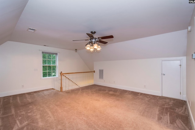 additional living space with ceiling fan, carpet, and vaulted ceiling