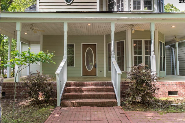 entrance to property featuring ceiling fan and a porch