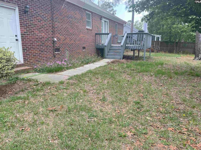 view of yard featuring a deck