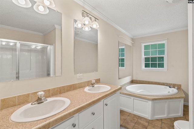 full bathroom featuring crown molding, toilet, double vanity, and a textured ceiling