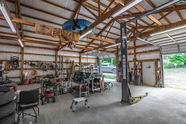 garage with a workshop area and metal wall