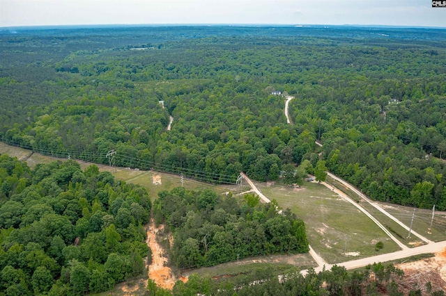 drone / aerial view with a view of trees