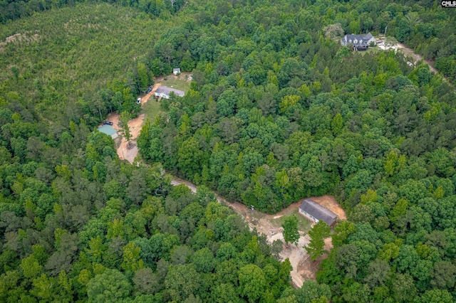 birds eye view of property with a wooded view