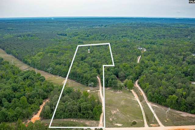 aerial view featuring a view of trees