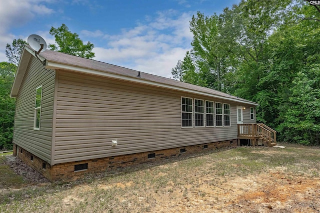 view of side of property with crawl space