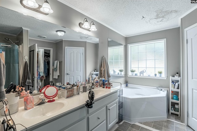 bathroom with tile patterned flooring, a textured ceiling, dual vanity, and ornamental molding