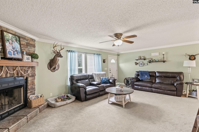 carpeted living room featuring ceiling fan, ornamental molding, and a stone fireplace