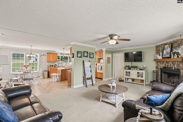 living room featuring crown molding, a fireplace, light colored carpet, a ceiling fan, and a textured ceiling