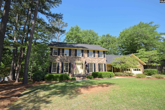 colonial home with a front lawn