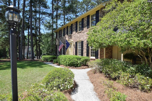 exterior space featuring a lawn