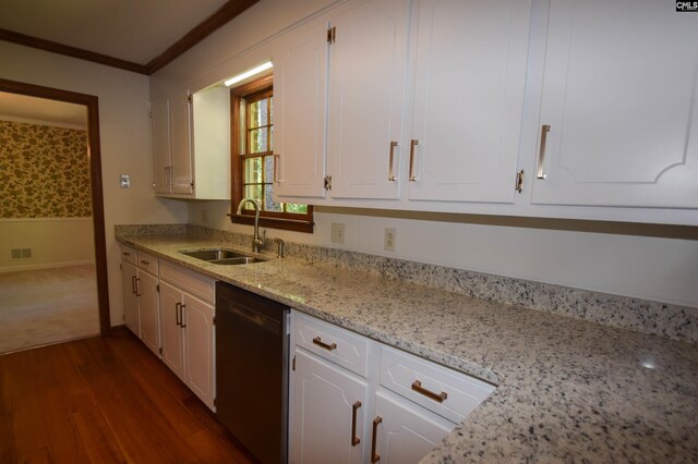 kitchen featuring white cabinetry, crown molding, dishwashing machine, and sink