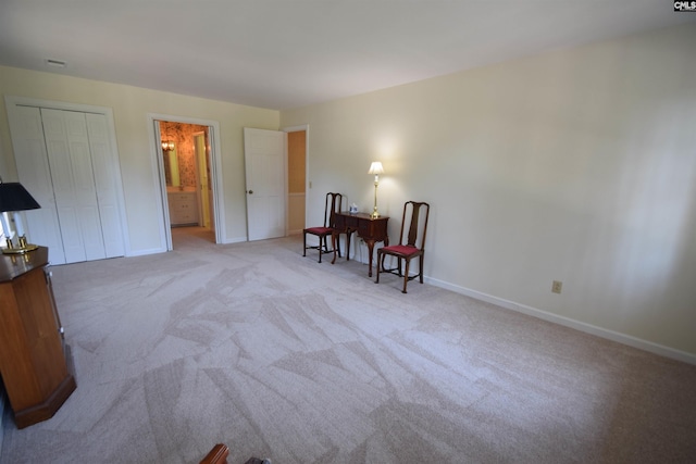 living area with light carpet