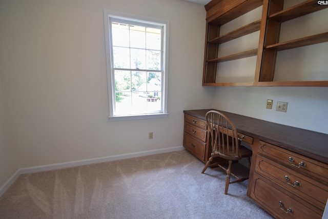 office featuring light carpet and built in desk