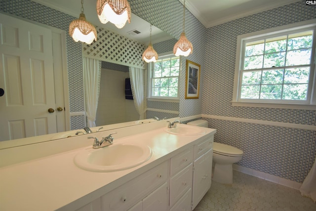 bathroom featuring ornamental molding, toilet, tile patterned flooring, and vanity