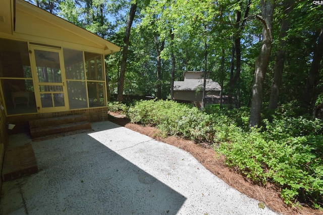 view of yard with a patio and a sunroom