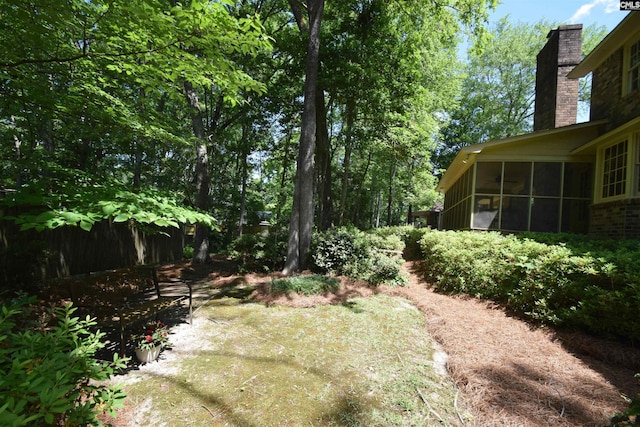 view of yard with a sunroom