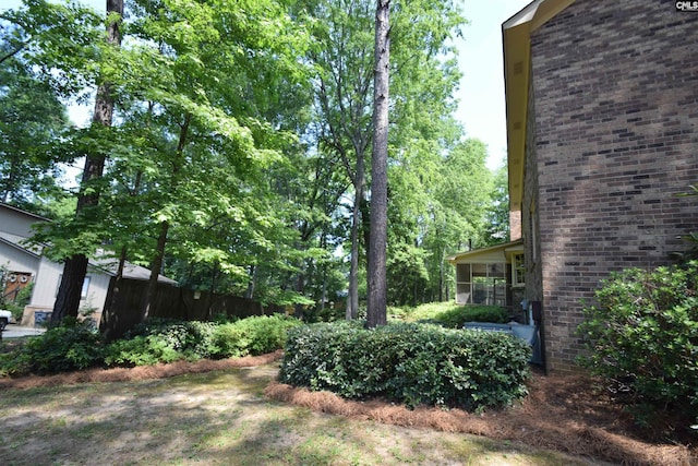 view of yard with a sunroom