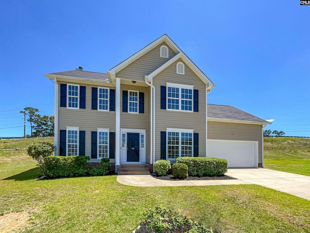 view of front facade featuring a garage and a front lawn