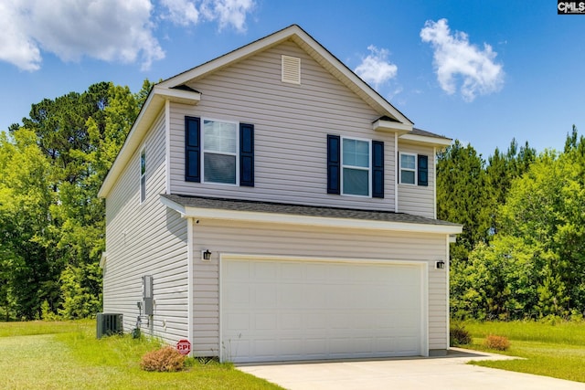 view of front of house with cooling unit and a garage