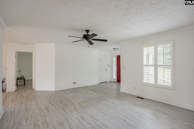 empty room featuring a textured ceiling, ceiling fan, light hardwood / wood-style floors, and crown molding