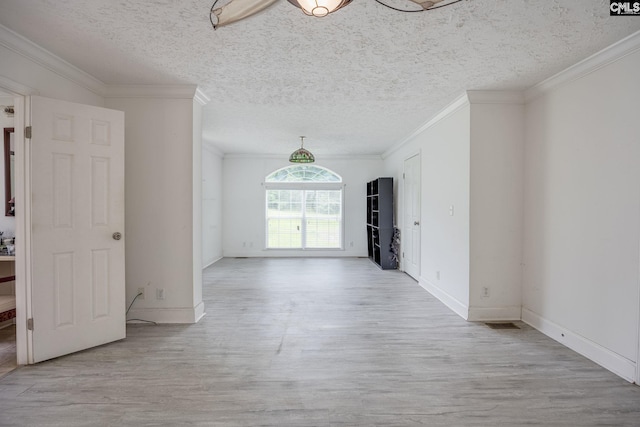 unfurnished living room with light hardwood / wood-style floors, a textured ceiling, and crown molding