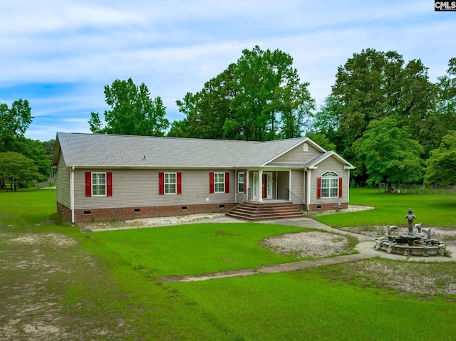 ranch-style house featuring a front lawn